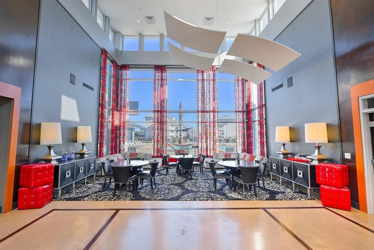 Modern lounge area with seating and tables common area at The Avenue at Orono in Orono Student Accommodation