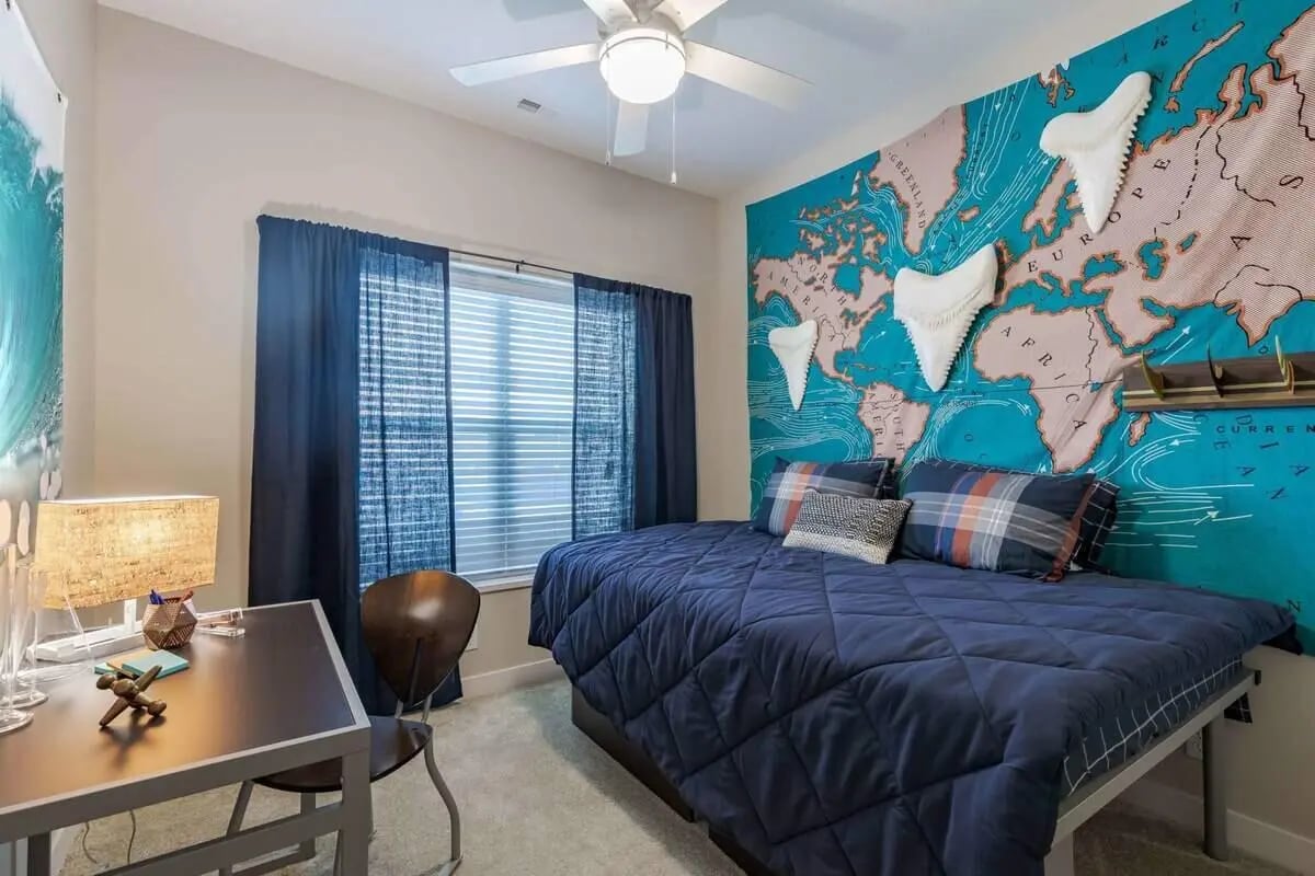 Bed desk chair world map mural bedroom at 8N Lofts in Lincoln Student Accommodation