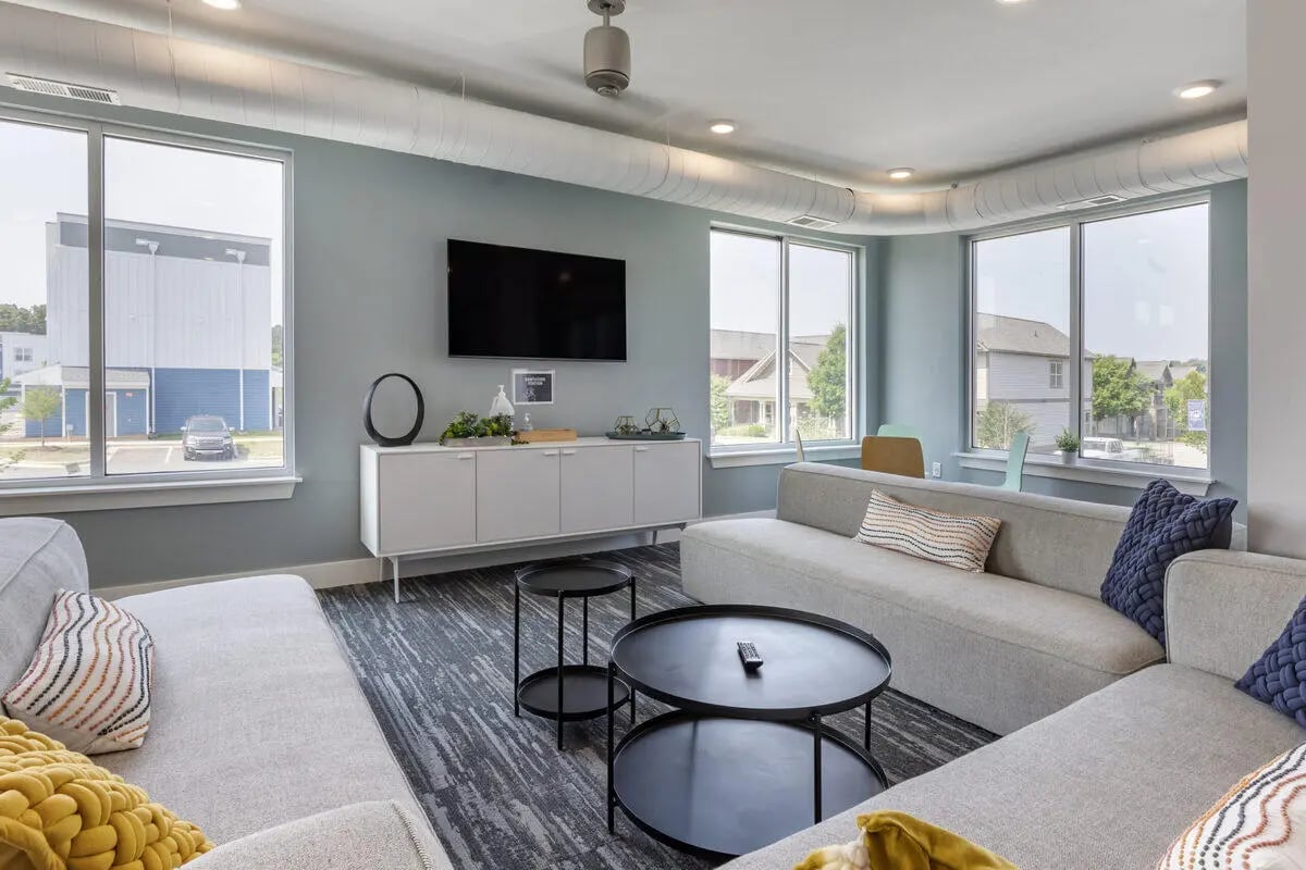 Sofa television console and coffee tables living room at Paloma Raleigh in Raleigh Student Accommodation