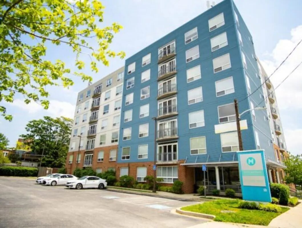 Apartment building with blue and white facade exterior at HH Cresmont Apartments in Baltimore Student Accommodation