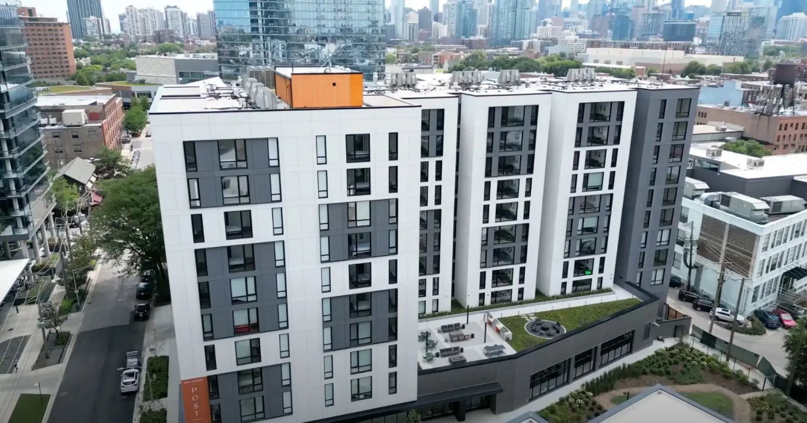 Modern apartment building with rooftop patio exterior at Post Chicago Apartments in Chicago Student Accommodation