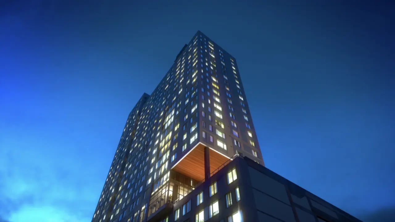 Lit apartment building with many windows exterior at The Connector Apartments in Atlanta Student Accommodation