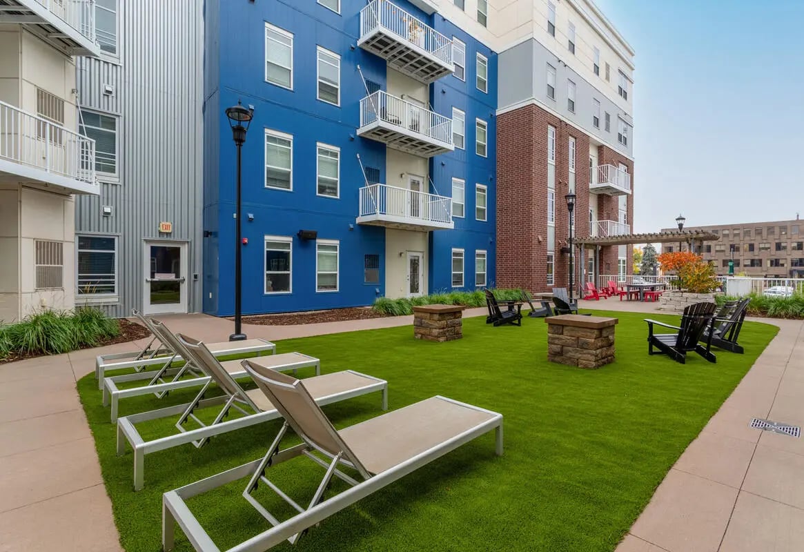 Lounge chairs and fire pits on lawn exterior at 44 North in Minneapolis Student Accommodation