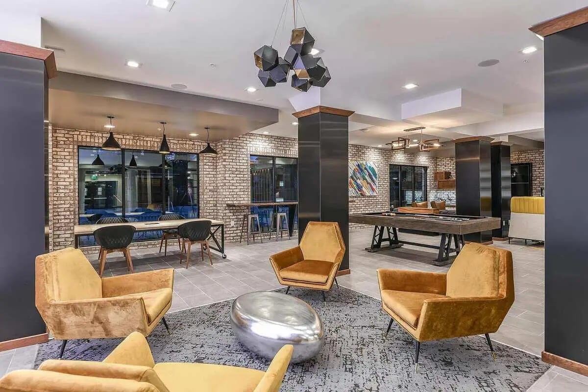 Chairs pool table and art living room at Aero on 24th in Gainesville Student Accommodation
