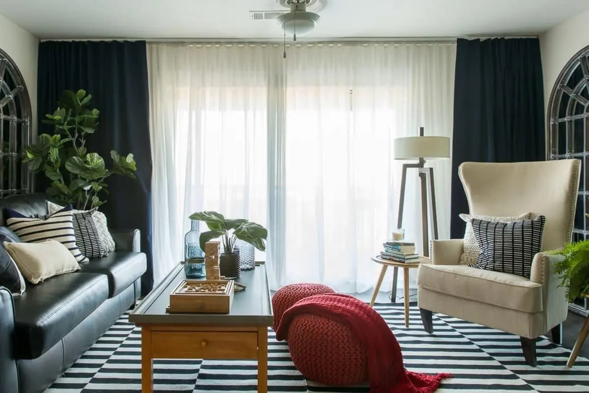 Leather couch chair and coffee table living room at The Holly in Lubbock Student Accommodation