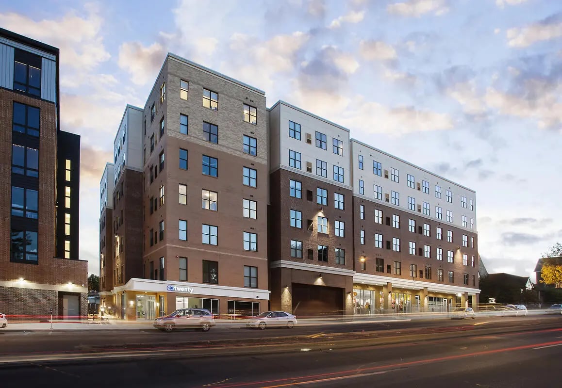 Apartment building with cars and street lights Exterior at BlockONE in Ames Student Accommodation