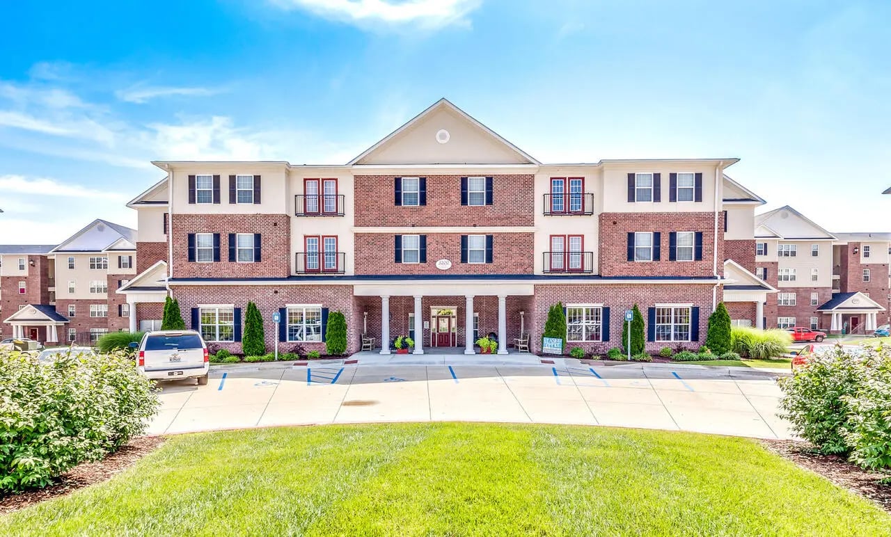 Apartment building entrance with parking lot exterior at Central House Columbia in Columbia Student Accommodation