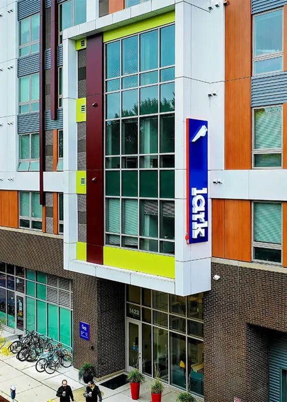 Modern building with colorful accents and bikes exterior at Lark at Randall in Madison Student Accommodation