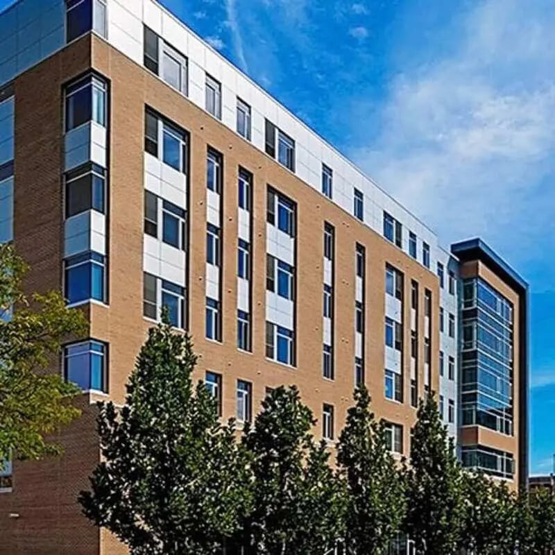 Modern brick building with many windows exterior at Lark on 14th in Milwaukee Student Accommodation