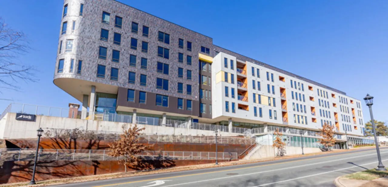 Modern building with multiple floors windows and balconies exterior at Lark on Main in Charlottesville Student Accommodation