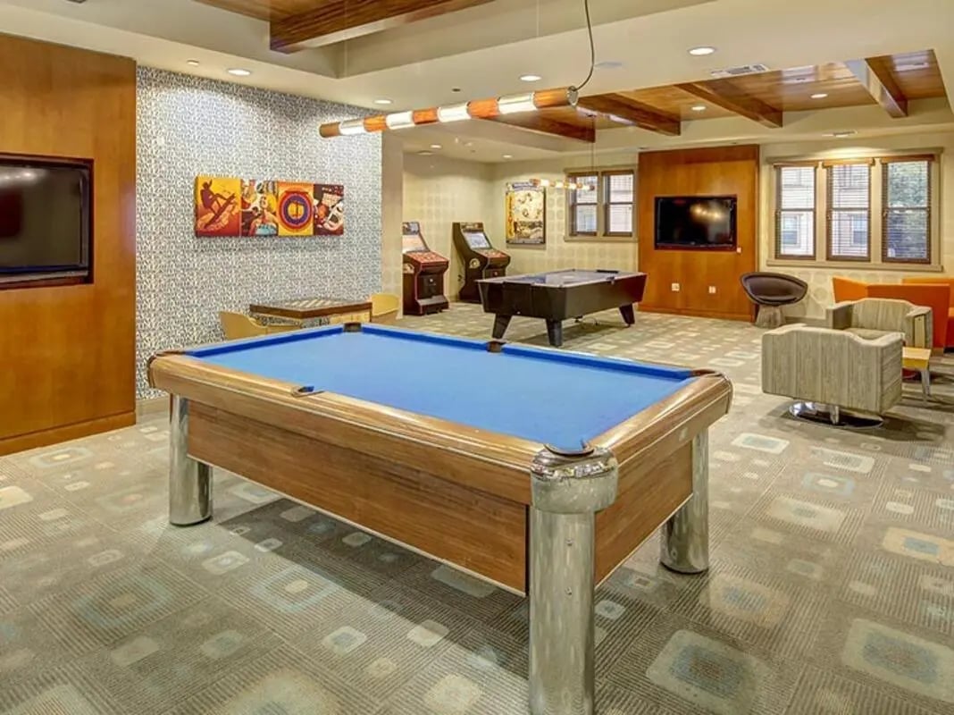 Pool table arcade games seating area playing area at Camino del Sol in Irvine Student Accommodation