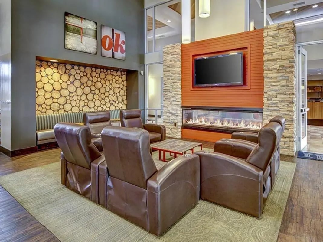 Leather recliners and fireplace common area living room at Hilltop Townhomes in Flagstaff Student Accommodation