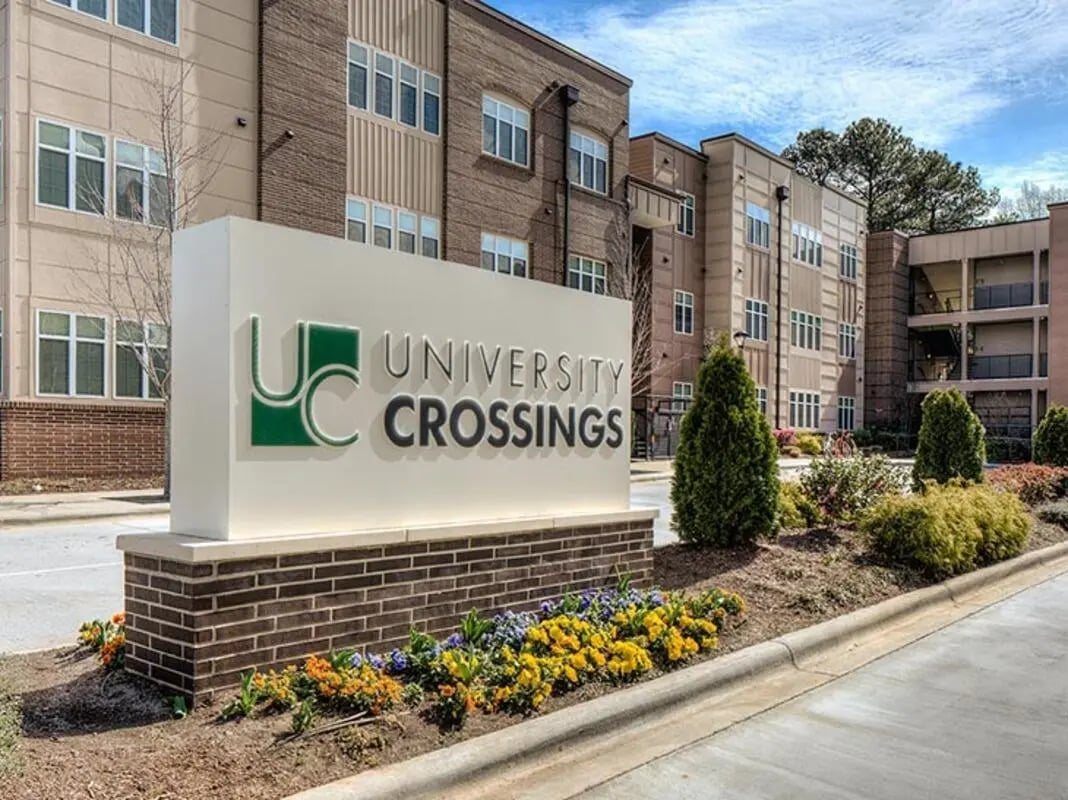 University Crossings sign building exterior at University Crossings Charlotte in Charlotte Student Accommodation