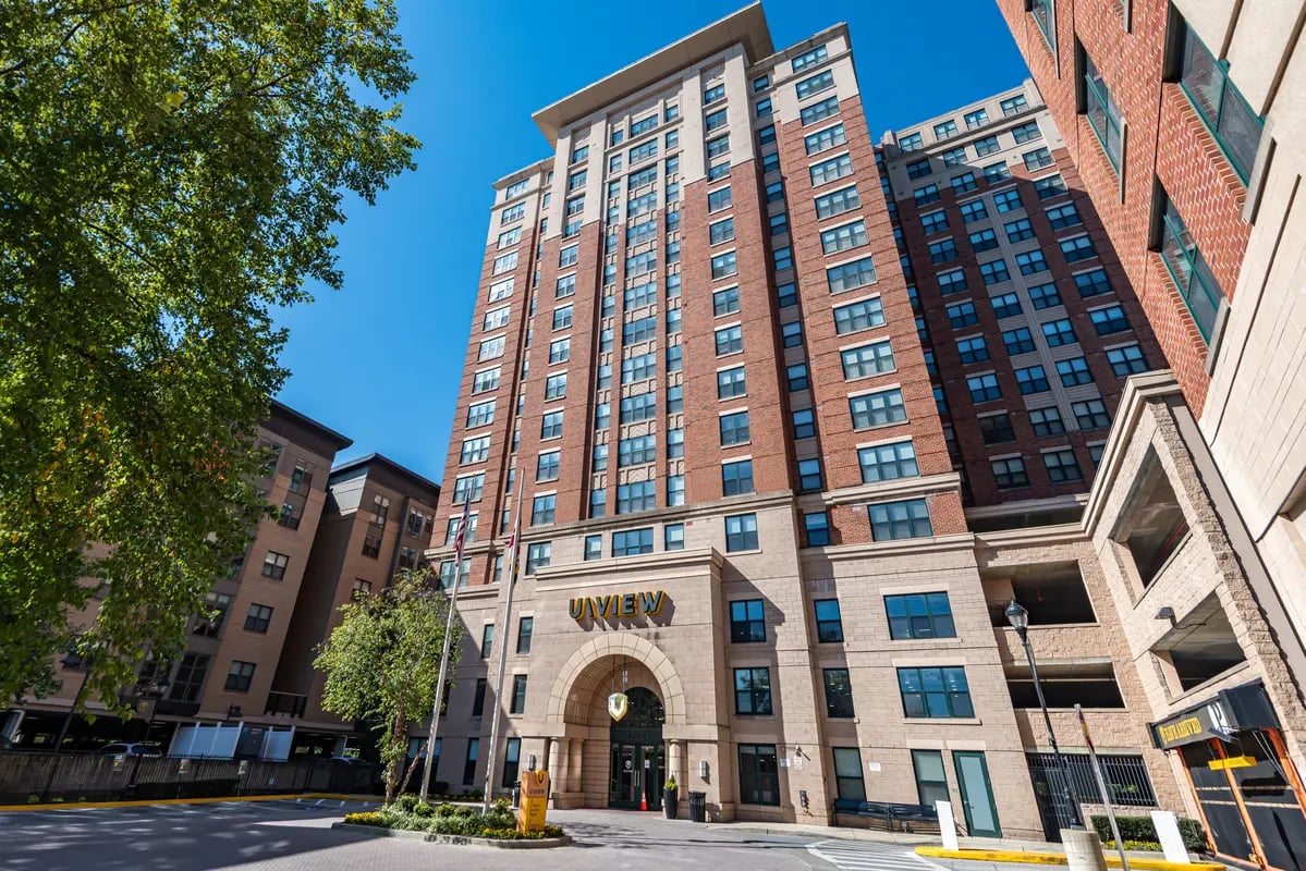 UVIEW entrance flanked by brick buildings Exterior at University View in Prairie View Student Accommodation