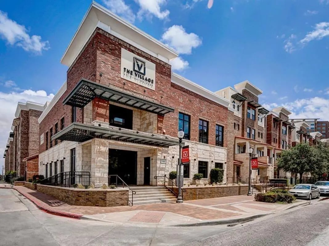 Brick building with stone accents exterior at The Village at Overton Park in Lubbock Student Accommodation
