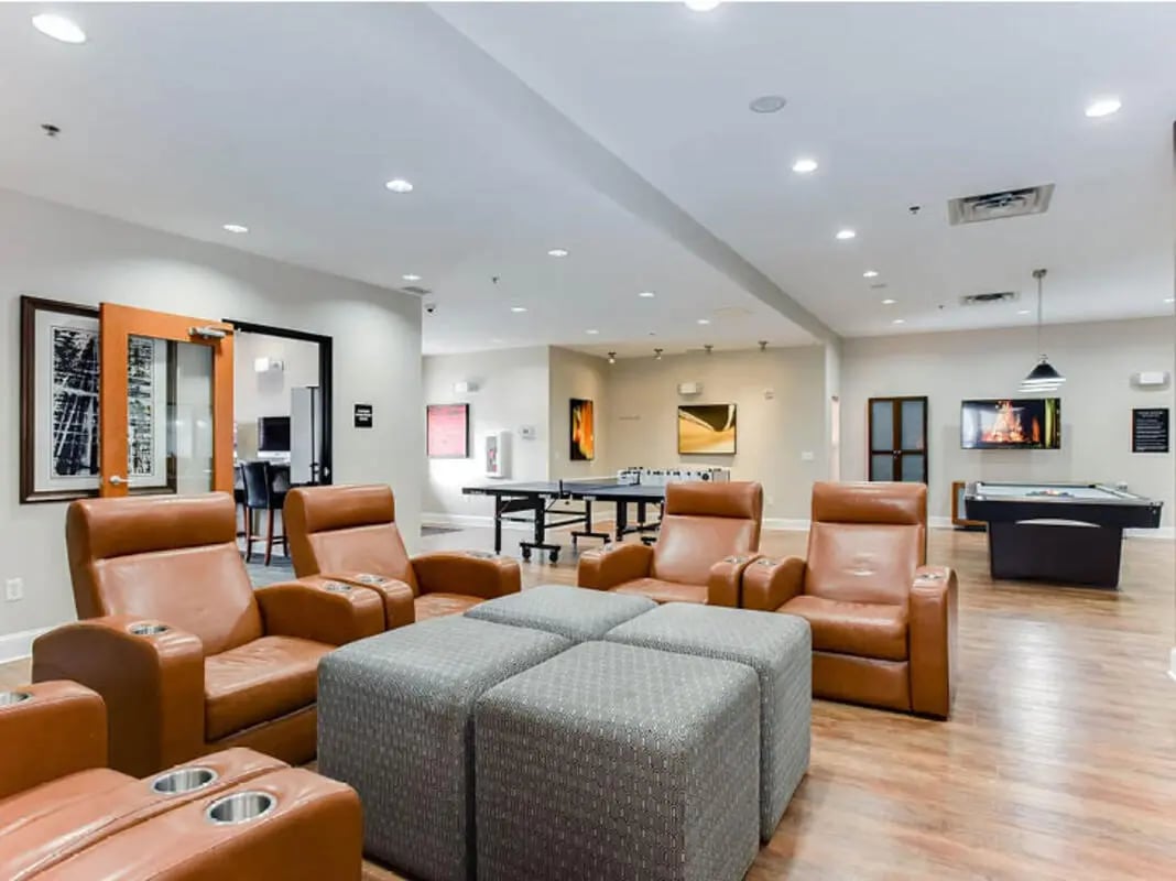 Leather chairs ping pong table pool table common area at University Commons in Minneapolis Student Accommodation