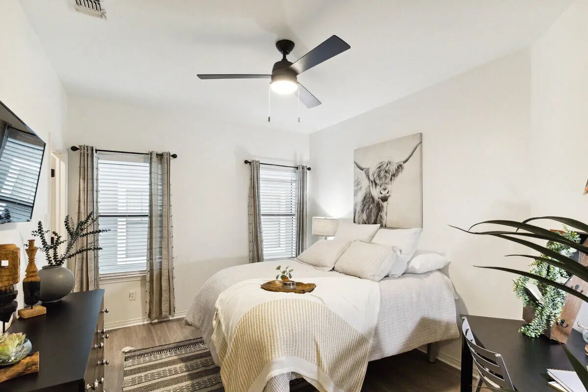 Bed with artwork and desk Bedroom at The Village on Telluride in San Marcos Student Accommodation