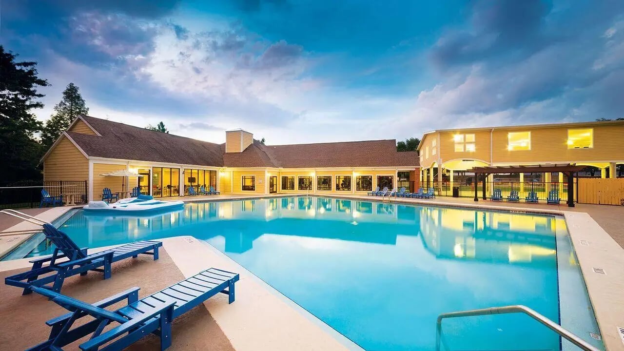 Large pool with lounge chairs exterior area at Apartments In Gainesville FL in Gainesville Student Accommodation