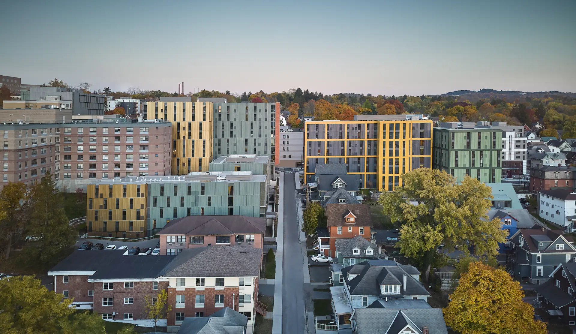 Modern apartments with yellow and green exteriors Exterior at Catherine Commons in Ithaca Student Accommodation