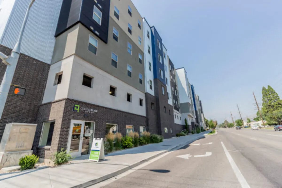 Modern multi-story building with leasing sign exterior at CollegePlace Provo in Provo Student Accommodation