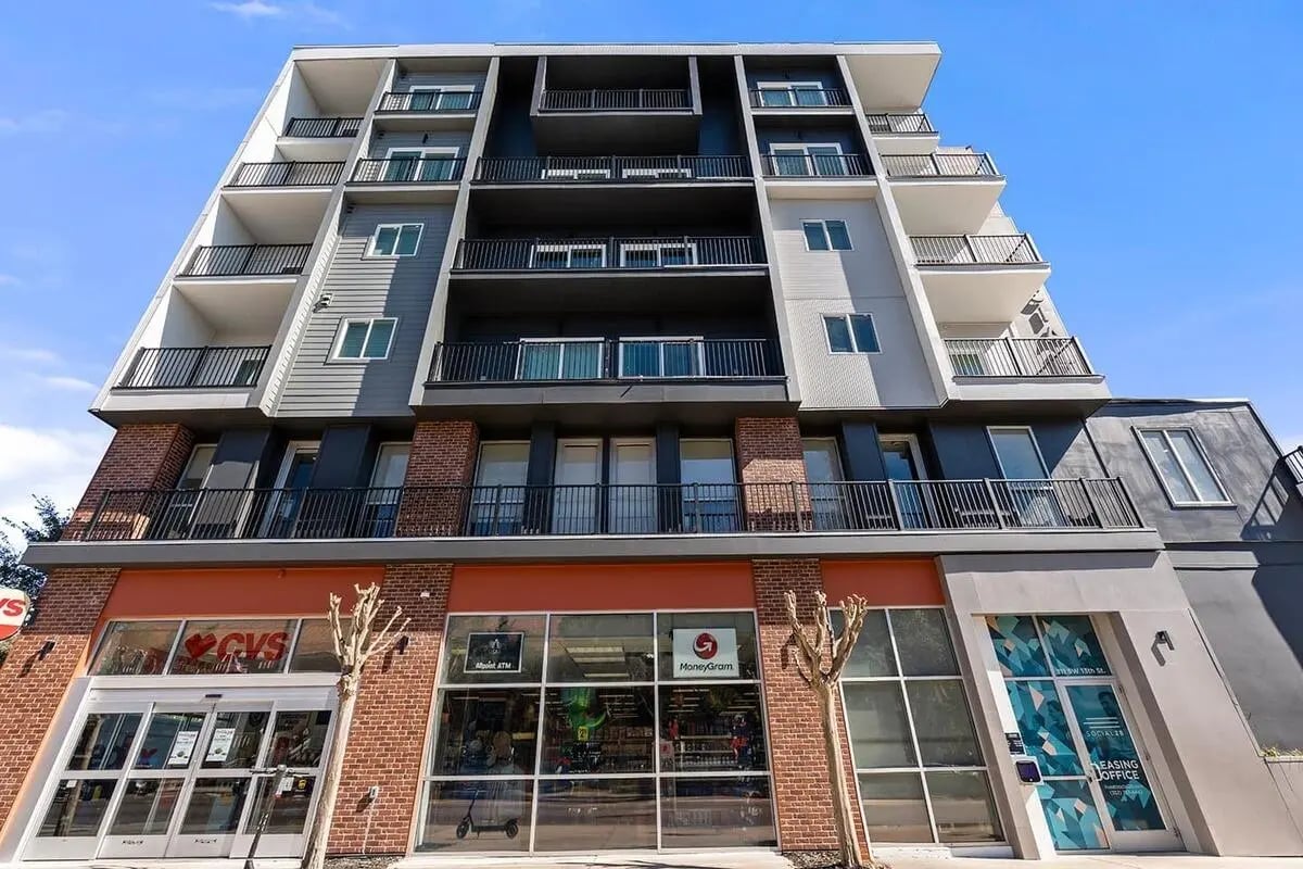 Modern building with balconies and storefronts exterior at Social 28 in Gainesville Student Accommodation