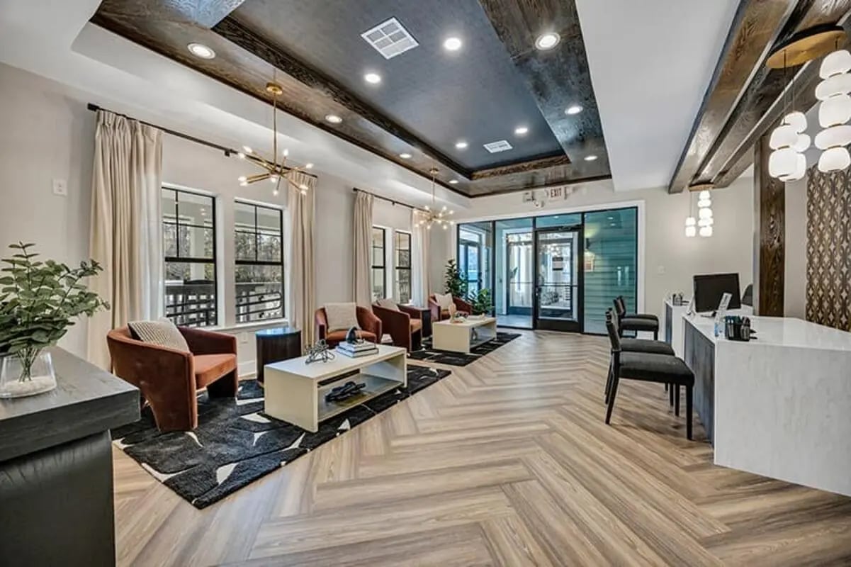 Lobby with reception desk seating and decor exterior at The Wilde Raleigh Apartments in Raleigh Student Accommodation