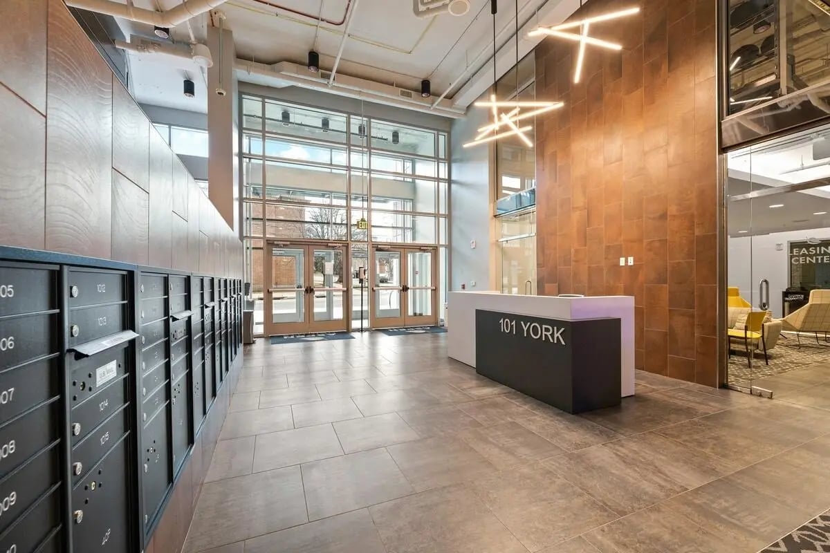 Mailboxes reception desk with 101 York sign lobby at Aspen Heights Towson in Towson Student Accommodation