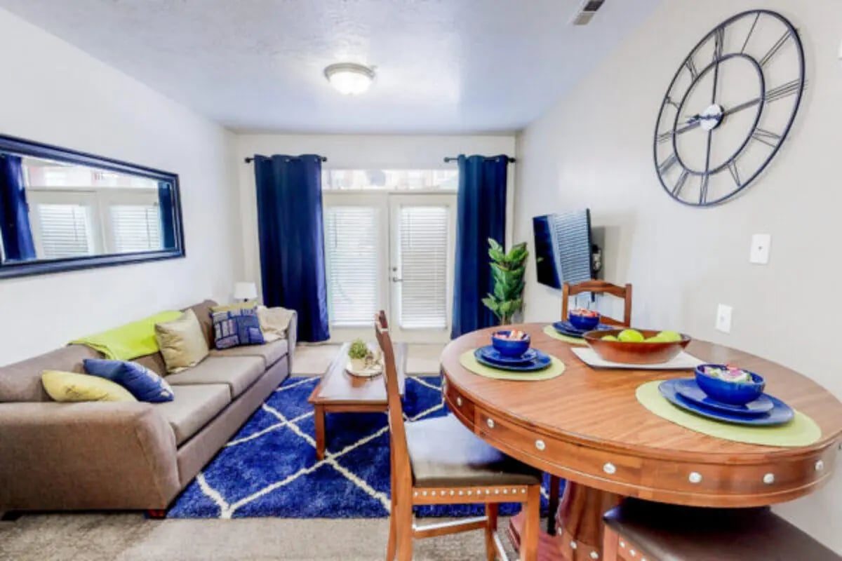 Sofa rug clock dining set living room at Alpine Village in Provo Student Accommodation