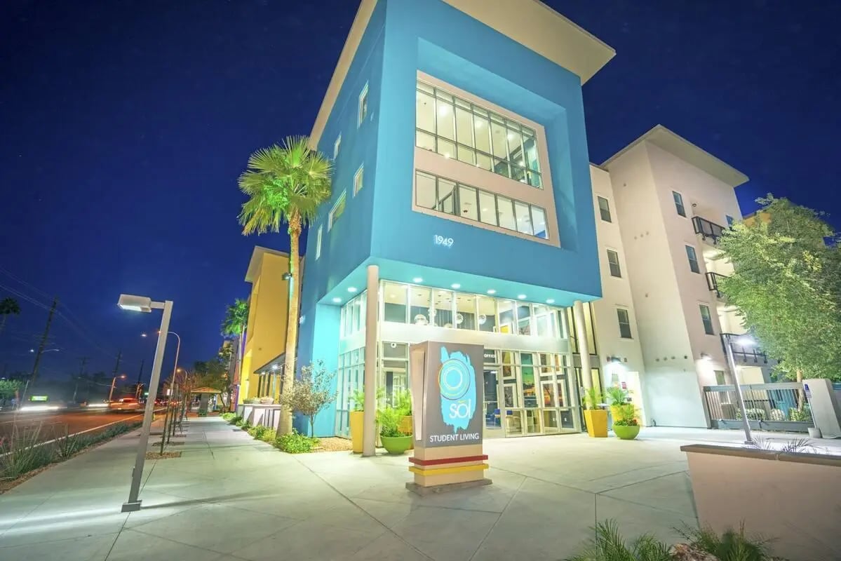 Modern apartment building entrance with signage exterior at SoL Tempe Apartments in Tempe Student Accommodation