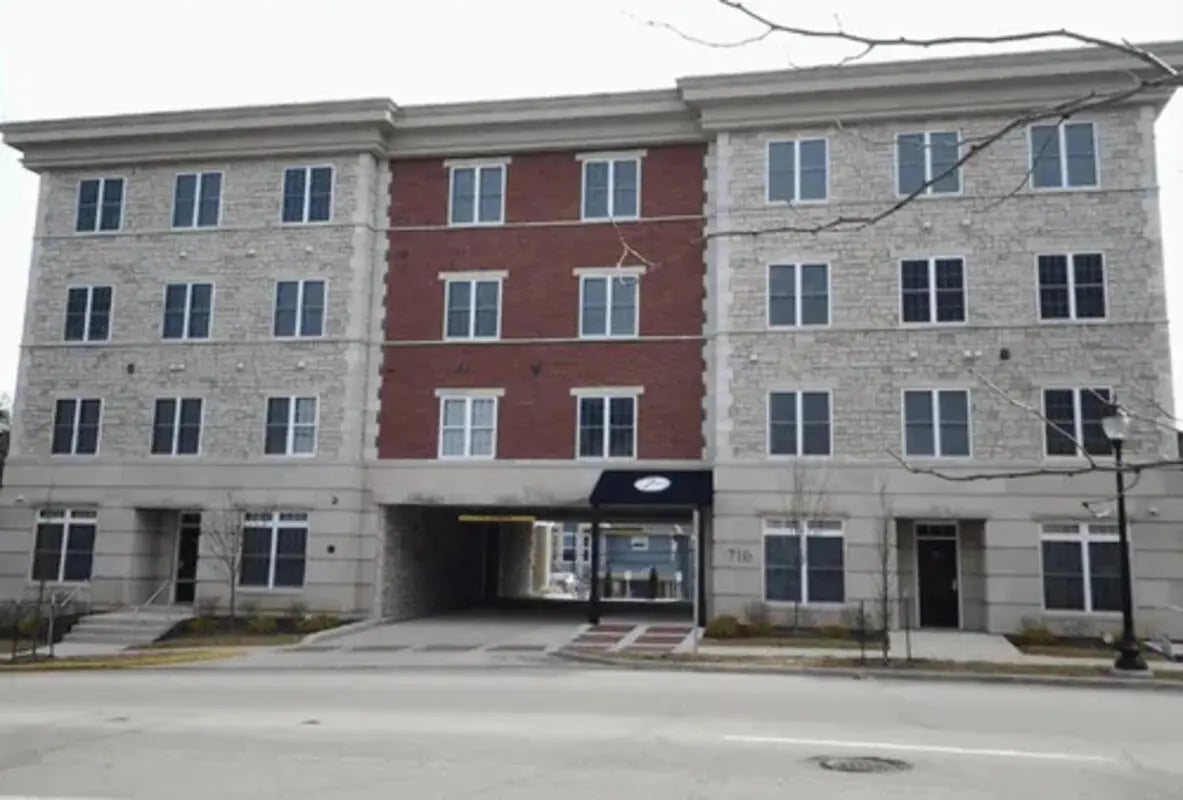 Modern building with red brick and stone exterior exterior at 9 North Apartments in Bloomington Student Accommodation