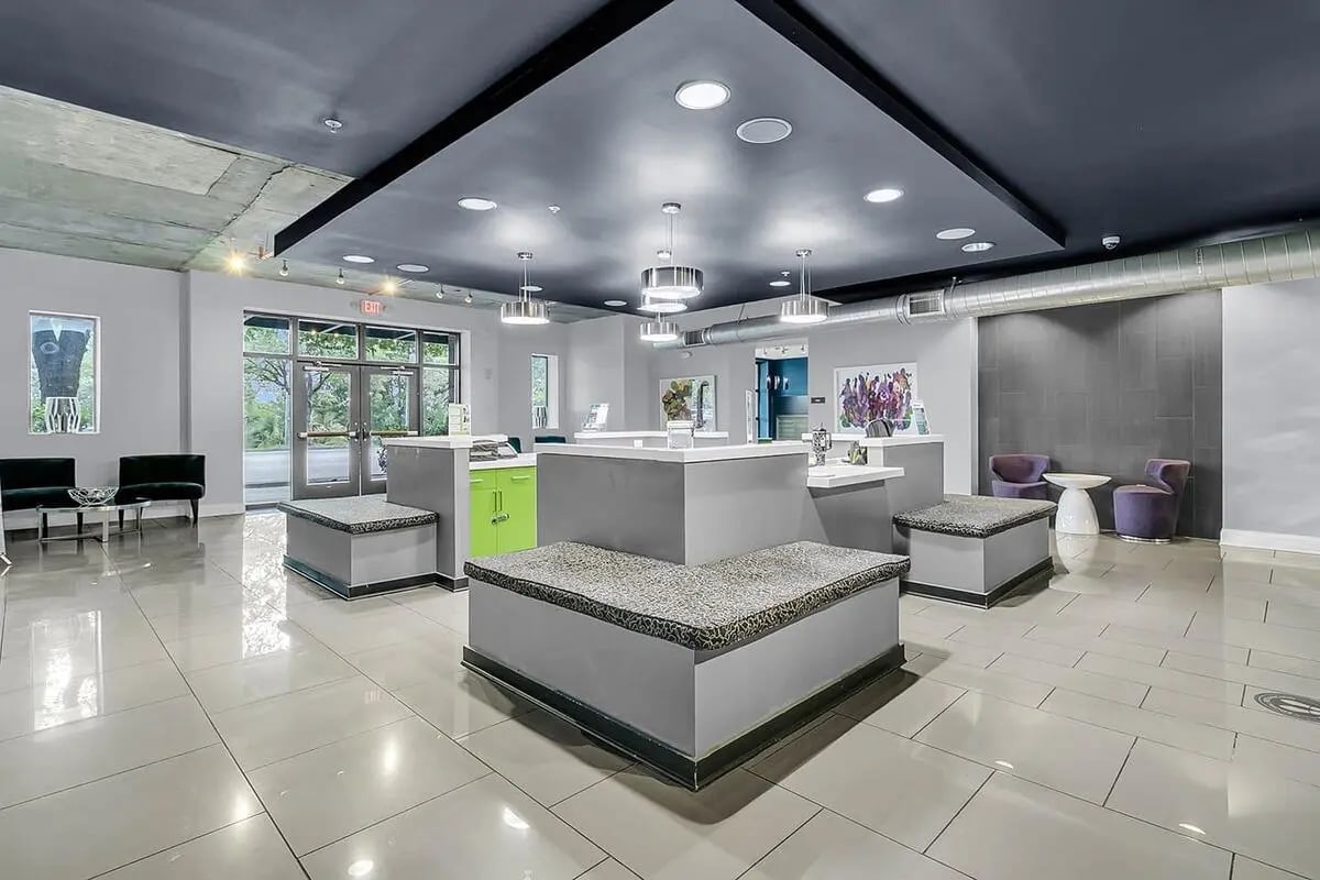 Modern lobby with seating and reception desks communal area at 930 NoMo in Charleston Student Accommodation