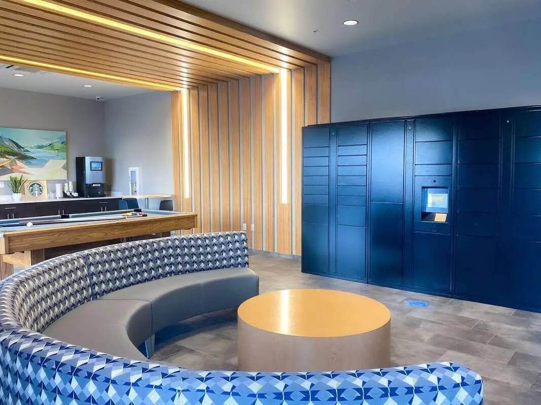 Pool table couch lockers and round table lounge area at 940 North in Spokane Student Accommodation