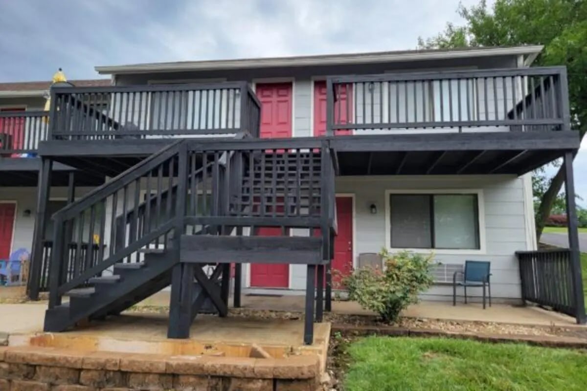 Apartment building exterior with stairs and balconies Exterior at Apple Lane Apartments in Lawrence Student Accommodation