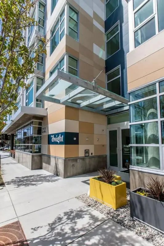 Dwight building entrance with glass canopy exterior at The Dwight by Arthaus in Berkeley Student Accommodation