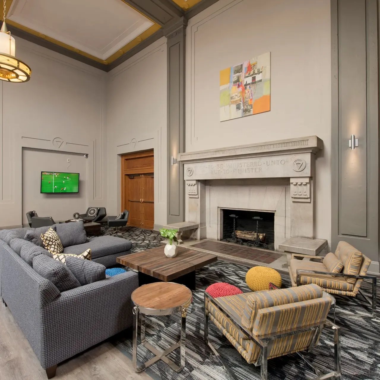 Lounge with sofa fireplace and tv living room at Domain at Cleveland in Cleveland Student Accommodation