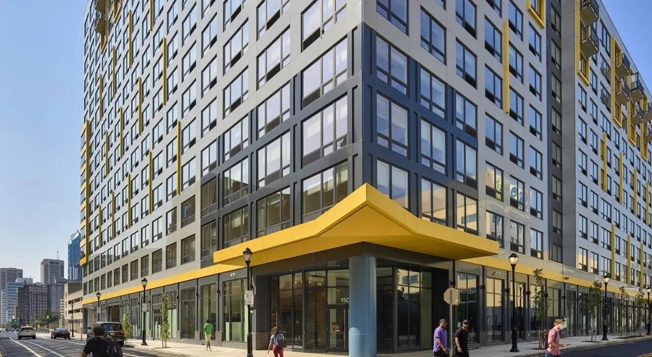 Modern building with yellow accents and glass windows exterior at The Hamilton in Philadelphia Student Accommodation