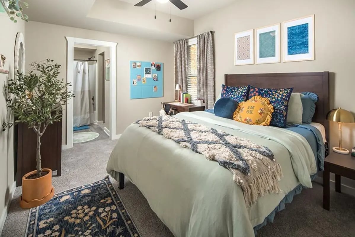 Bed with plants and desk bedroom at Highpointe in Boone Student Accommodation