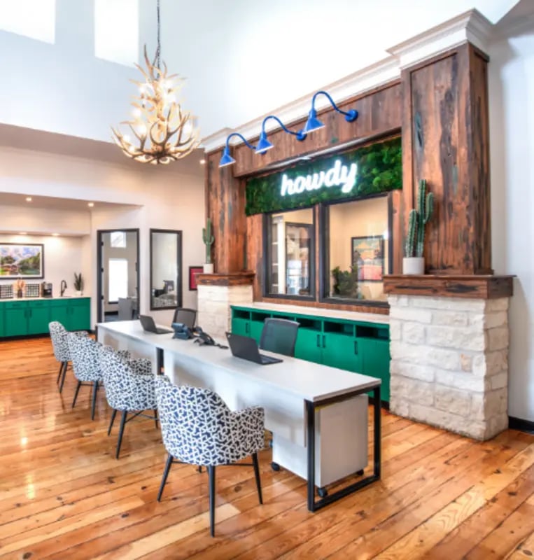 Study desks with chairs and laptops reception area at Hillside Ranch in San Marcos Student Accommodation