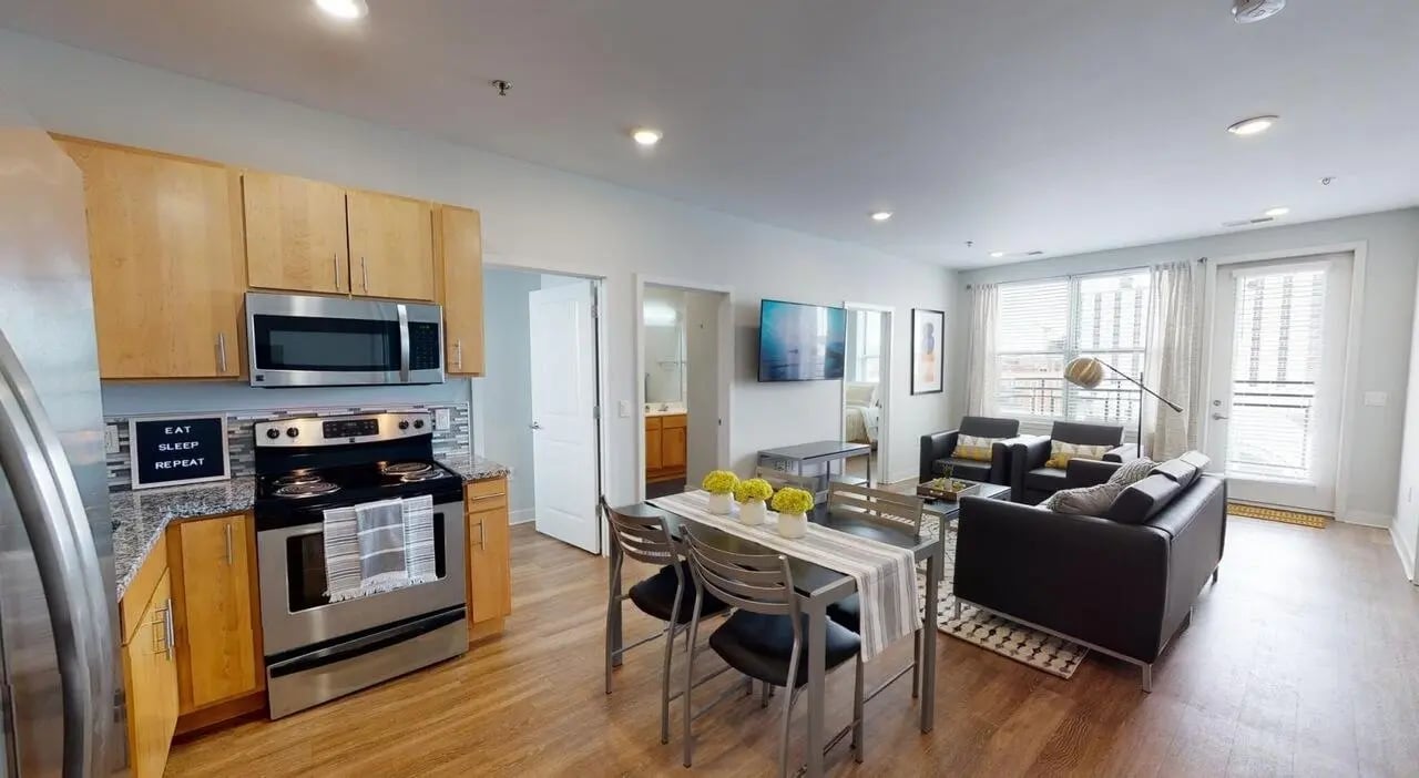 Modern kitchen dining and living area living room at Lancaster Apartments in Champaign Student Accommodation