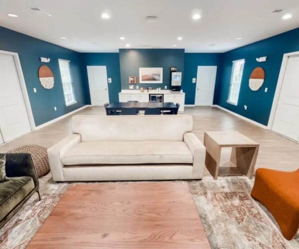 Sofas coffee table and cabinets living room at The Hamptons Statesboro in Statesboro Student Accommodation