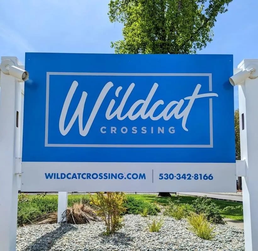Wildcat Crossing sign exterior with landscaping at Wildcat Crossing in Chico Student Accommodation