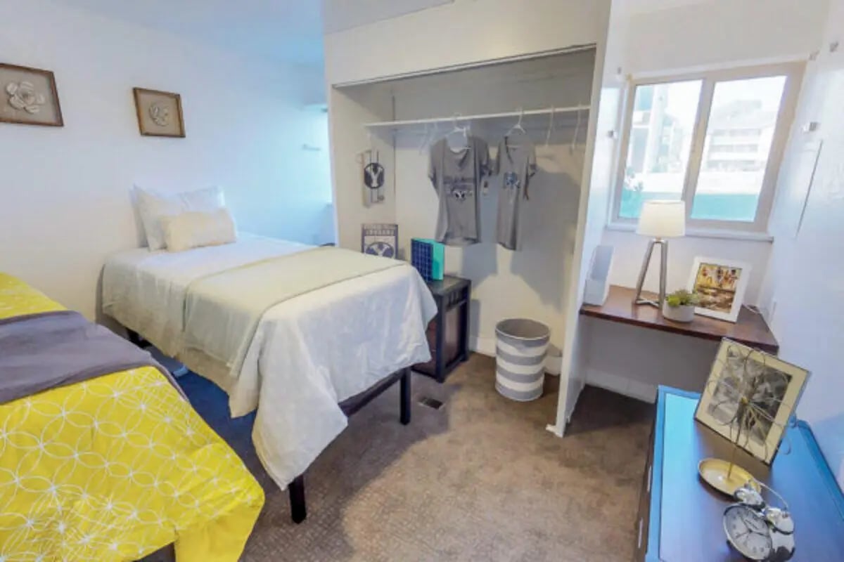 Two beds closet and desk bedroom. at Stadium150 Apartments in Provo Student Accommodation