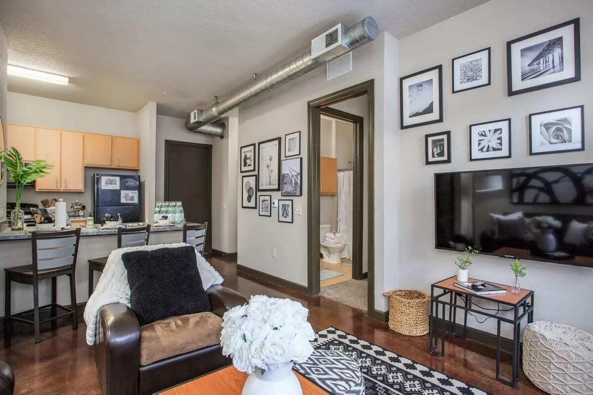 Leather chair kitchen area and bathroom living room at 4050 Lofts in Tampa Student Accommodation
