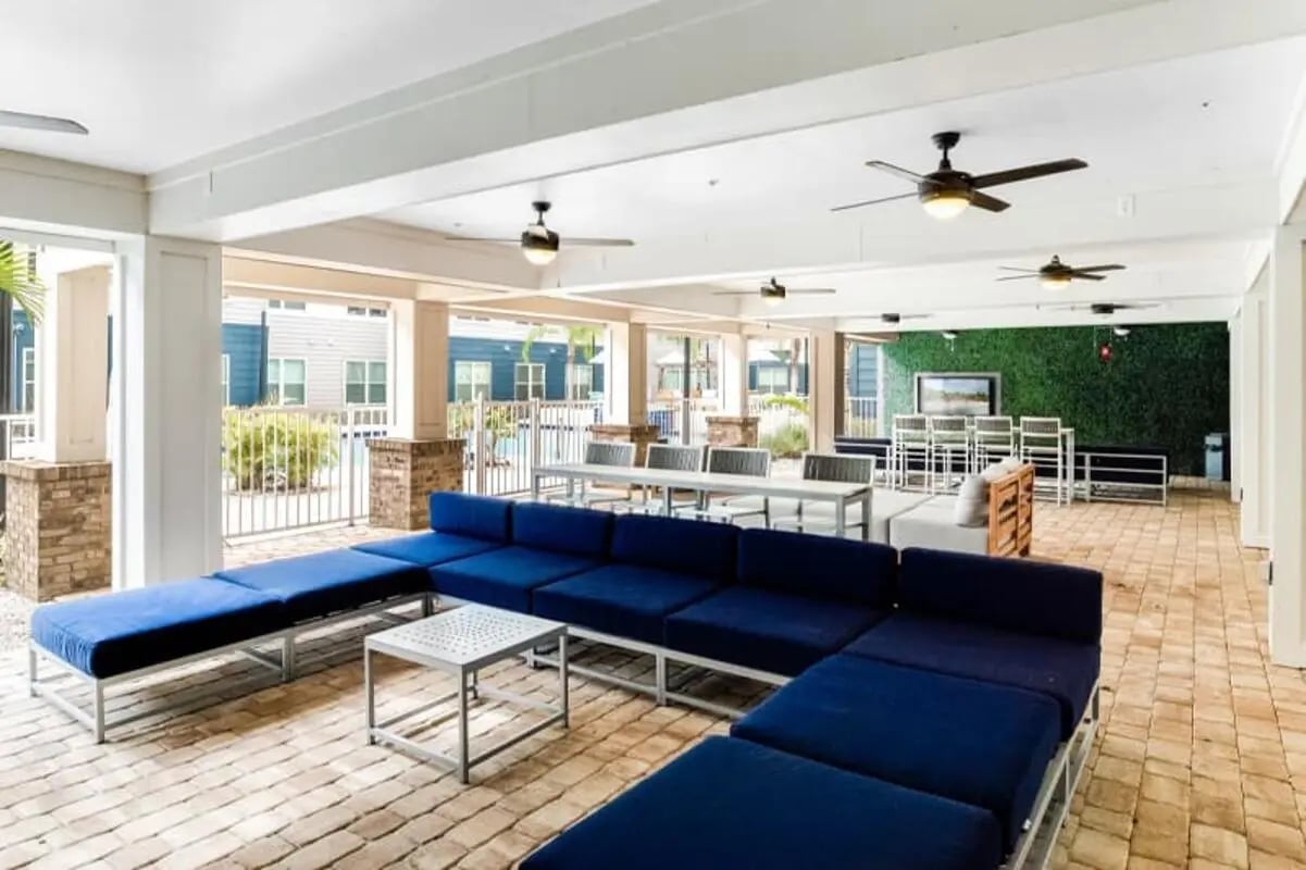 Blue sectional sofa with coffee table lounge area at Halo 46 Apartments in Tampa Student Accommodation
