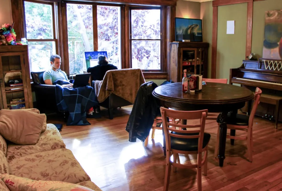 Living room with piano table and chairs at Berkeley Student Cooperative - Affordable Student Housing Co-op in Berkeley Student Accommodation