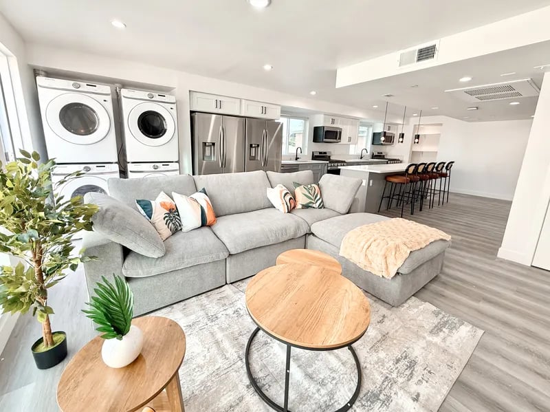 Sectional sofa with colorful pillows kitchen and laundry Living Room at 1587 W 35th St in Los Angeles Student Accommodation