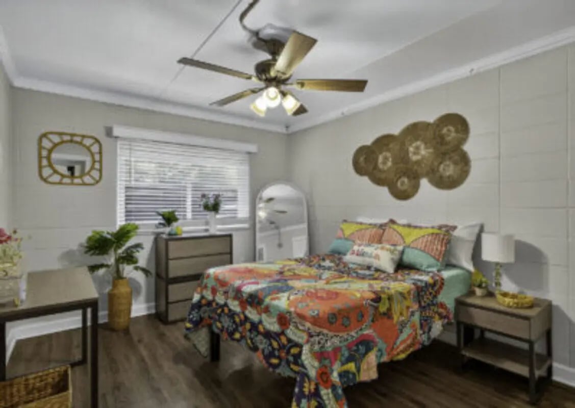 Colorful bed with dresser and desk Bedroom at 759 Basin LLC in Tallahassee Student Accommodation
