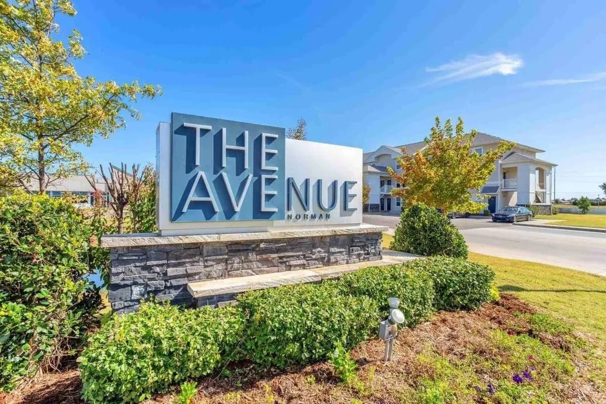 Large property sign for The Avenue Norman exterior at The Ave at Norman Apartments in Norman Student Accommodation