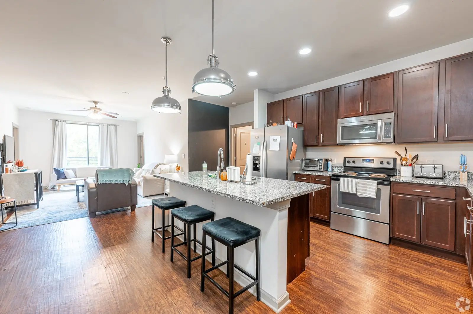 Kitchen island with stools stainless steel appliances kitchen at Eclipse on Broad in Athens Student Accommodation