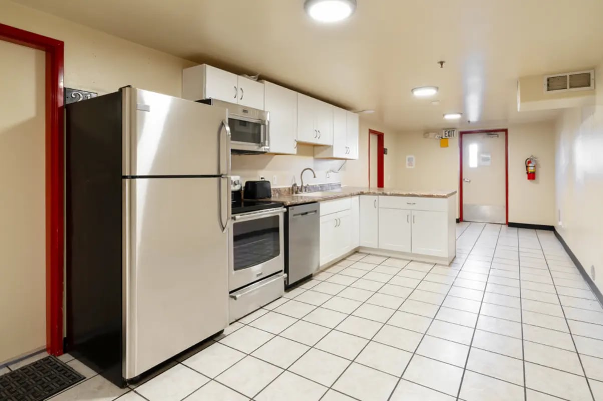 Stainless steel appliances white cabinets and counter kitchen at Dixie Cove Student Housing in St. George Student Accommodation